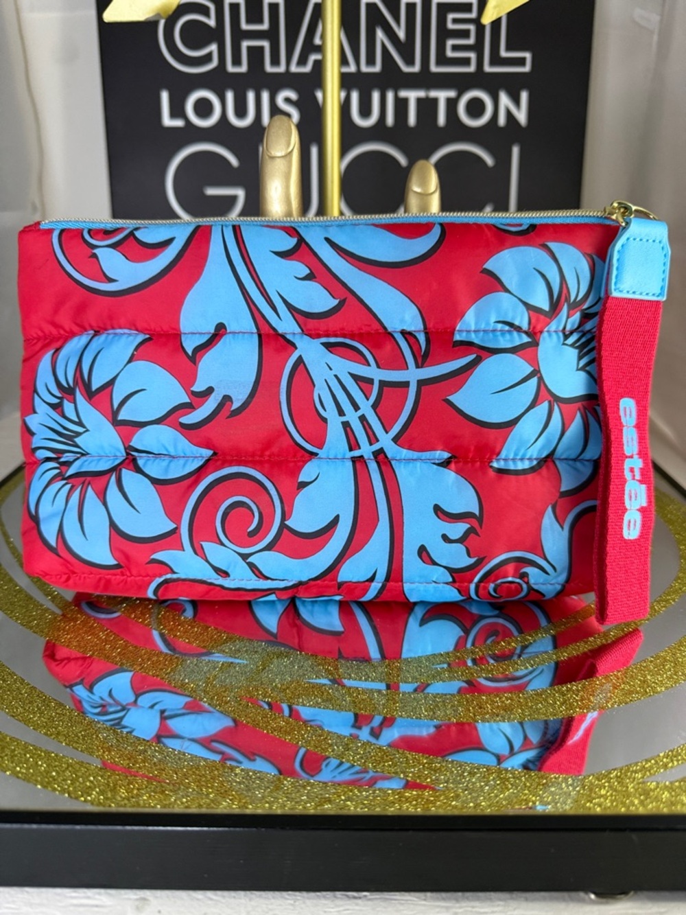 Estee Lauder Red and Blue Floral Puffer Wristlet with Branded Strap